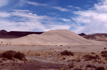 desert landscape with mountains and clouds