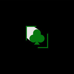 Fototapeta premium Minimalist design of a green club suit on a black background symbolizes luck