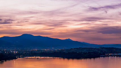 Sunset Over Hobart, Tasmania – Evening Cityscape with Mountains and Water Reflections