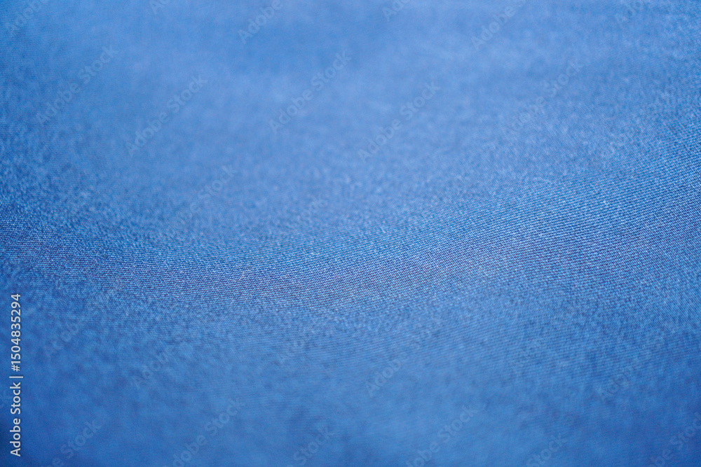Aufkleber a captivating close-up presents the subtle texture of soft blue fabric, perfect for adding a calming
