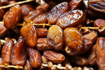 A luscious pile of dates, their glossy surfaces glistening with natural sugars. Perfect for a...