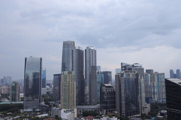 High Angle View Of City Skyline With Modern High Rise Buildings Under A Cloudy Sky
