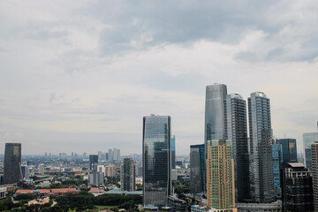 Elevated View Of Metropolitan Area With Skyscrapers Under Cloudy Sky