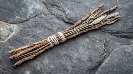 Dried sage bundle on stone, rustic background, herbalism