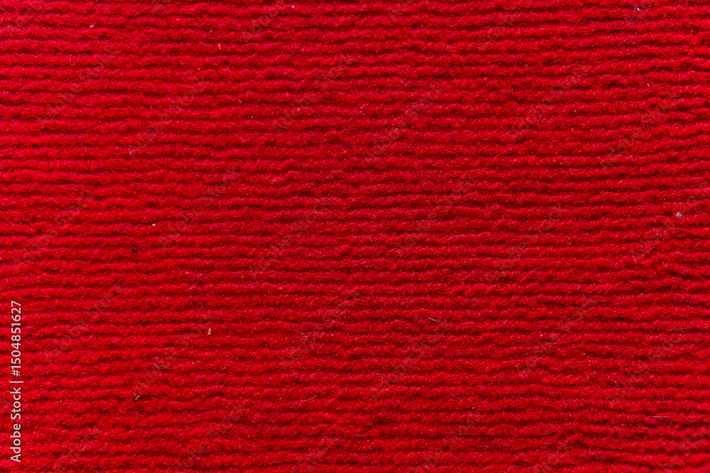 Poster detailed close-up of a vibrant red fabric with a textured surface, showcasing depth and warmth. idea