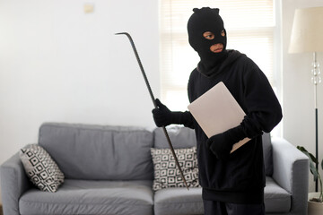 Laptop Theft in Progress as Masked Intruder Moves Quietly Through The House.