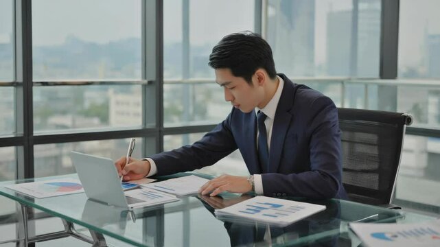 Strategic Insights: Businessman Reviewing Reports at Work