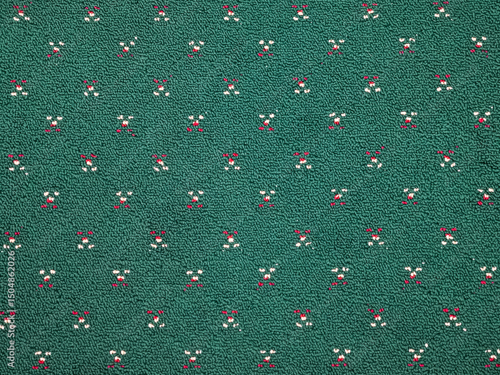 Poster detailed close-up of textured fabric displaying a repeating pattern of small, abstract floral shapes