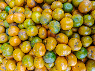 A vibrant pile of mandarin oranges showcases the beauty of natural fruit. The colorful citrus fruit, perfect for healthy snacks and vibrant cuisine, offers freshness and visual appeal.