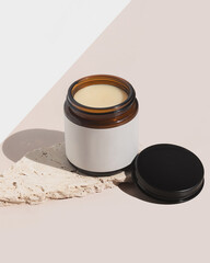 Natural and organic beef tallow balm on tan background with product texture