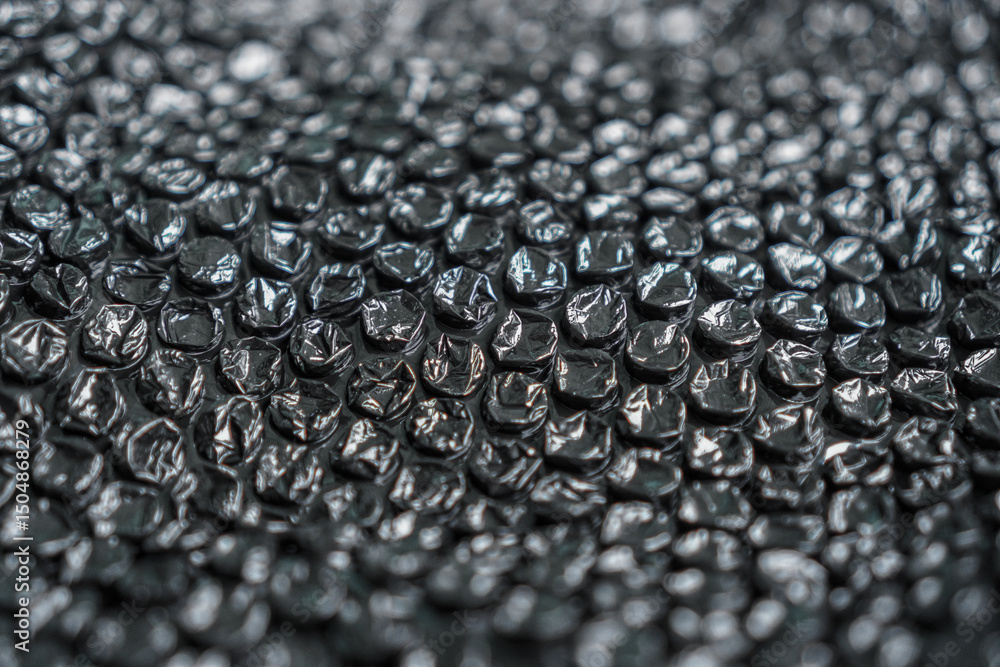 Poster a close-up abstract shot highlights a shiny surface formed by a pattern of spherical and oblong shap
