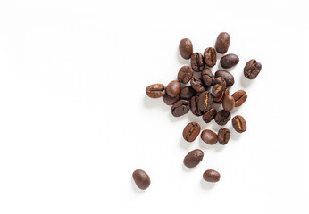 Brown roasted coffee beans seeds. Isolated of coffee bean on white background. Close up image.