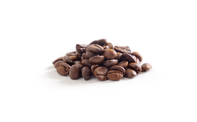 Coffee beans on white background. Pile of coffee beans. Close up image.