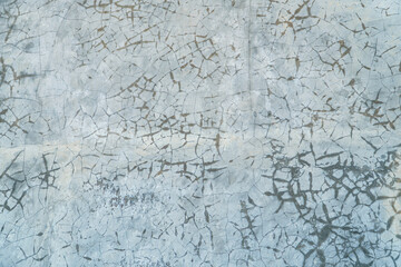 Detailed cracked texture with an intricate pattern. This background exhibits a network of fine lines and subtle tonal variations for use in overlays and abstract designs.