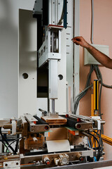 Innovative semi-automatic machine enhances efficiency in wrapping rectangular boxes for various packaging needs