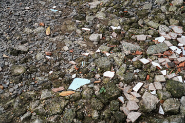 A versatile ground texture featuring a mix of rocks, stones, and tile shards, ideal for adding...