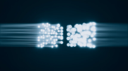 Obraz premium Data Transmission: Abstract representation of high-speed data transmission across fiber optic cables, depicted by glowing particles moving rapidly.