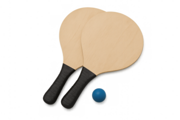 Two wooden beach tennis rackets and a blue ball lying on a transparent background, ready for a game on the sand