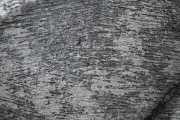 An abstract background showing a textured grayscale design, highlighting a blend of light and dark...
