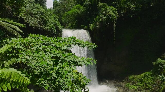 Waterfall in a tropical forest. Aerial survey of Hikong Alo Falls. Lake Sebu. Mindanao, Philippines. Travel concept.