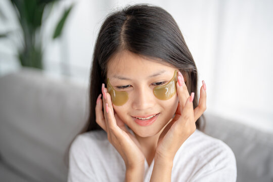 Daily beauty routine Asian woman  self care and relax with silicone under eye patches  smiling happy using skincare product