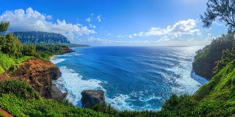 A grand, sweeping view of a deep blue ocean with waves crashing against rocky cliffs