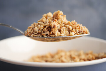 Healthy granola served in a bowl with spoon