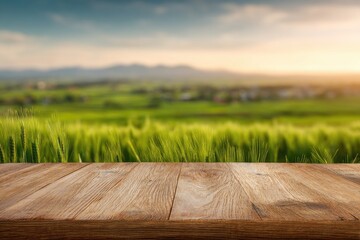 Rustic wooden table against a blurred background of a vibrant green field at sunset, showcasing rolling hills and a tranquil countryside scene