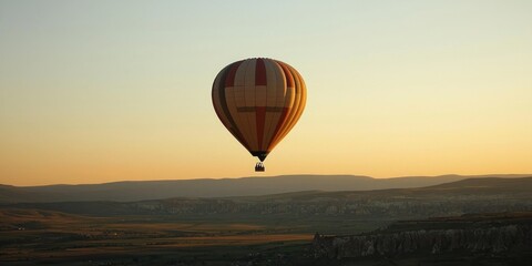 Obraz premium A magical morning in Turkey, where hot air balloons rise over the valleys and historic caves