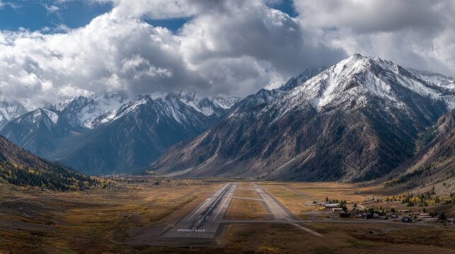 Airplane landing on remote mountainous runway scenic valley aerial view nature's grandeur