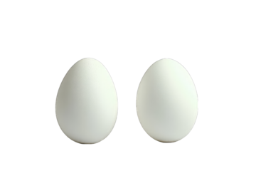 Two pristine white eggs, side-by-side, against a black background, exhibiting subtle textural variations