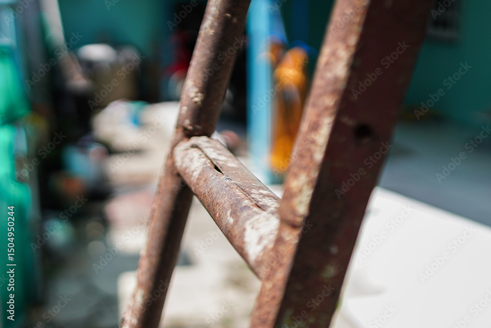 Poster an abstract close-up captures the textures of aging metal. weathered ladder suggests resilience and 