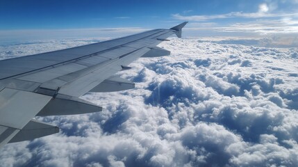 Obraz premium Aerial view of airplane wing over clouds sky photography daytime scenic perspective