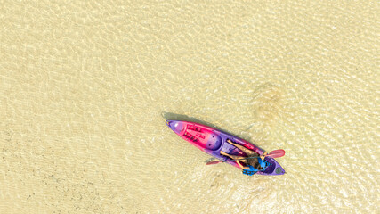 Aerial view of a kayak in the blue sea .man kayaking he does water sports activities.	