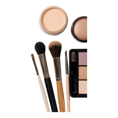 A set of makeup brushes, eyeshadow palette, and face powders arranged neatly.