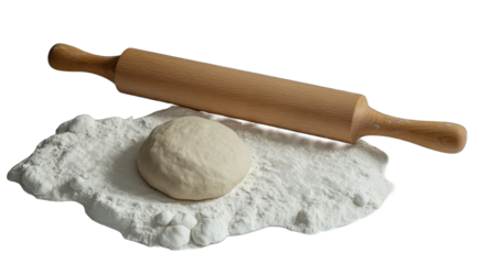 A ball of unbaked dough rests on a dusting of flour beside a wooden rolling pin