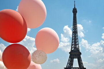 Paris,France - May 14, 2025: Colorful Balloons and le Tour Eiffel on blue sky background