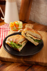 Mexican Chicken Breast Torta. Healthy homemade sandwich with grilled chicken breast, mayonnaise, lettuce, tomato, and other vegetables and toppings.