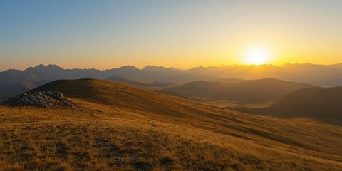 A viewpoint on a high plateau, with the setting sun casting golden light over distant peaks