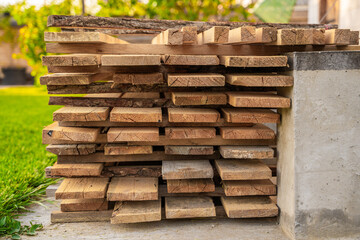 Wooden construction boards stacked close-up