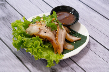 Charcoal-boiled Pork Neck with the Sauce is Spicy Sour Taste is a Popular Appetizer in Thailand.
