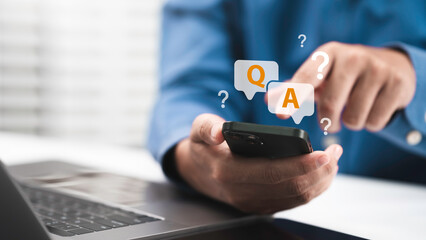 Plakat Businessman hand clicking Q&A or Question and Answer button FAQ( frequency asked questions) Q and A - Answer, Question Ask, Information, Communication Concepts on digital platform