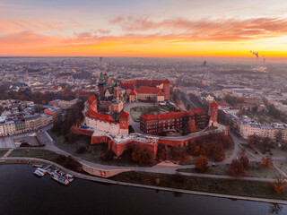 Wawel castle landmark with city view near river in Krakow Poland. Autumn landscape on coast river...