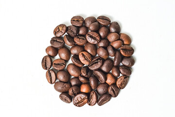 Top view of roasted coffee beans isolated on white background. Texture, detail, background, half, above, high angle, Close up, circle shape.
