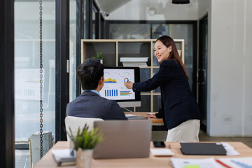 Business asian Team Reviewing Documents, business woman's hands meticulously reviewing a stack of...