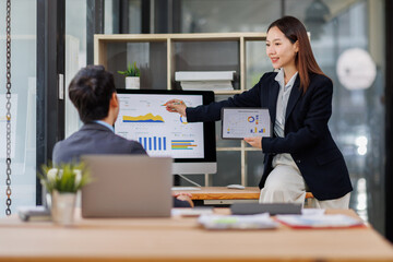 busy work Business team working at office multiple screen computer or smart tablet on table desk at office in documents data analyst, data science scientist for business.

