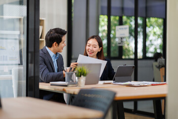 Business team working at office with documents on his desk, doing planning analyzing the financial report, business plan investment, finance analysis concept	
