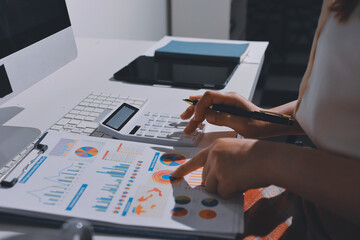 Expert woman asian female people review data number costing managerial account prepare monthly...