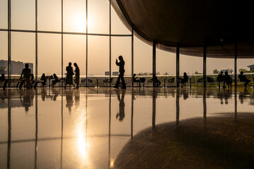 Sunset Silhouettes in a Modern Atrium