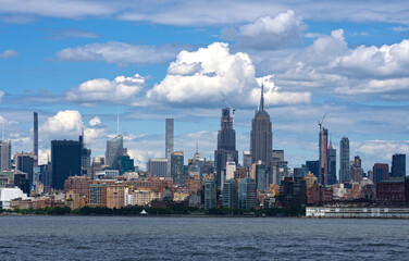 Fototapeta na wymiar NYC skyline with skyscrapers. Manhattan and Brooklyn. New York City skyline with Hudson River views. Downtown NYC. New York from waterfront skyline. Tower of of New York.